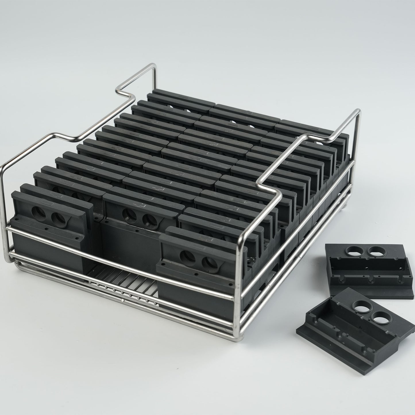 A tray of silicone molds to make clear ice blocks of Collins spear shapes.