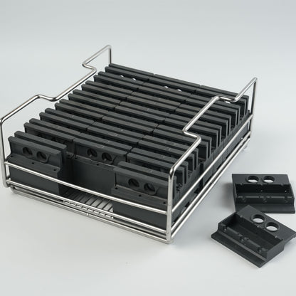 A tray of silicone molds to make clear ice blocks of Collins spear shapes.