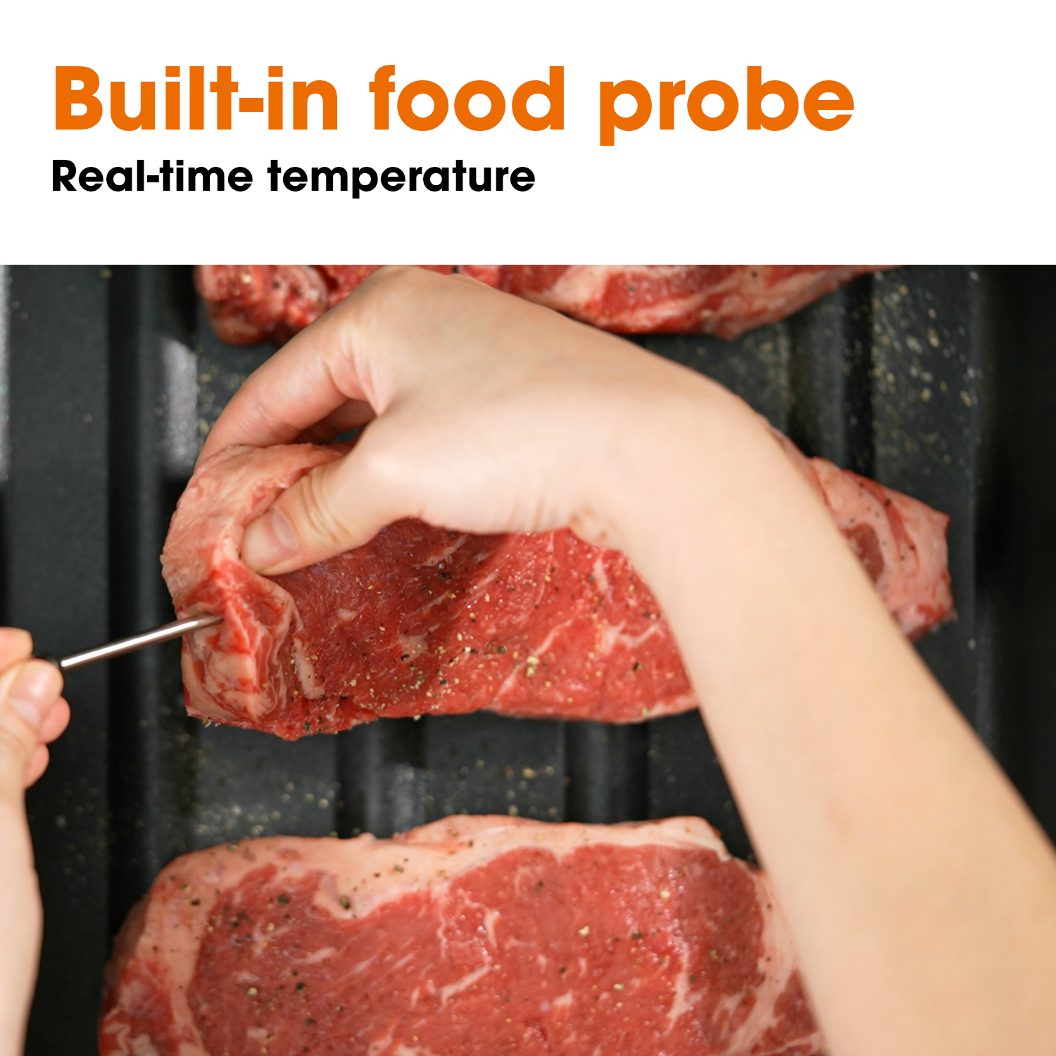 Person inserting a built-in food probe to a steak placed in the tray of Neovide