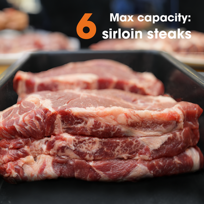 Raw sirloin steaks in a tray with text indicating max capacity.