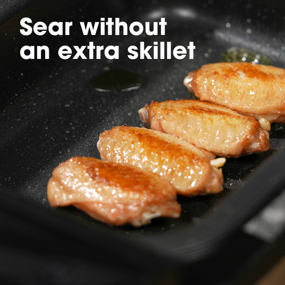 Chicken wings being seared in Neovide sous vide cooker with text 'Sear without an extra skillet'.